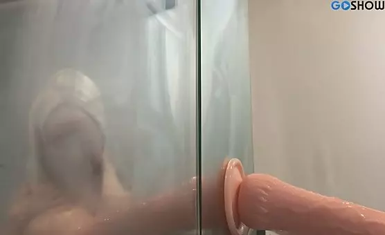 Woman Sucks Big Dildo in Shower Scene